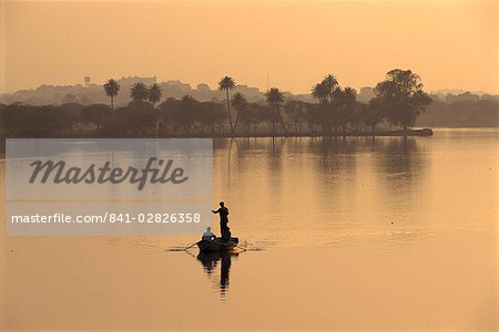 Men fishing in lake created by dam, Deogarh, Rajasthan state, India, Asia