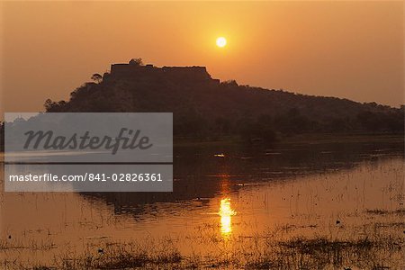 Sunset over lake in town, Deogarh, Rajasthan state, India, Asia