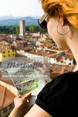 Woman Reading Map, Lucca, Lucca Province, Tuscany, Italy
