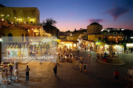 Aerial view over the pavement cafes and restaurants in the Old Town Square at dusk, Rhodes Town, Rhodes, Dodecanese Islands, Greek Islands, Greece, Europe