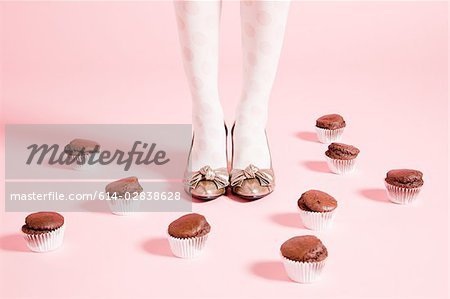 Legs of  woman and cakes