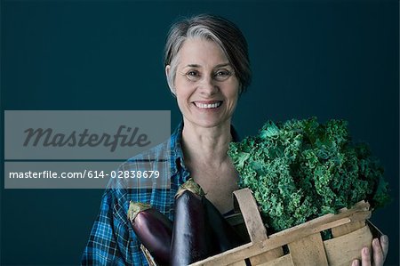 Woman with basket of vegetables