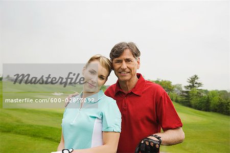 Father and Daughter Golfing