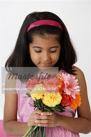 Girl holding bouquet of flowers
