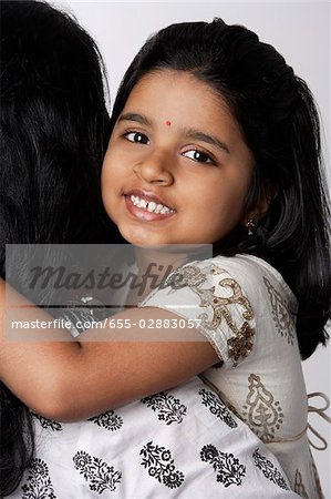 Woman holding little girl