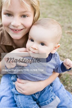 Boy Holding Baby Brother
