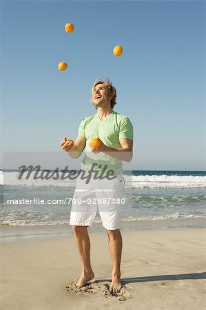 Man Juggling at Beach, Ibiza, Spain