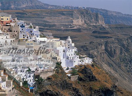 Aerial view over the houses of Fira Town, the capital of Santorini (Thira), perched on the Caldera Rim, Cyclades, Greek Islands, Greece, Europe