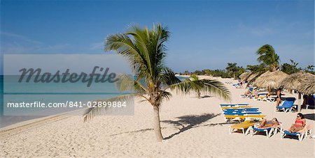 Sun beds and palm tree the Playa Ancon next to the Hotel Brisas del Mar, Trinidad, Cuba, West Indies, Central America