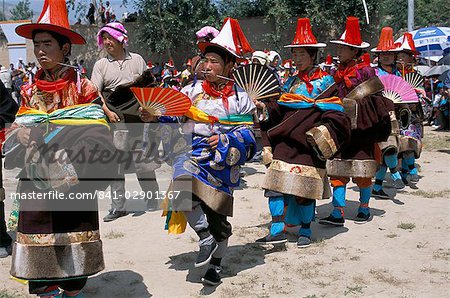 Tibetans dressed for religious shaman's ceremony, Tongren, Qinghai Province, China, Asia