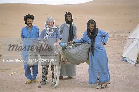 End of desert trek photo, tourist with guide, cook, camel man and donkey, Chigaga, Draa Valley, Morocco, North Africa, Africa