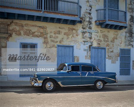 An old blue Chevrolet car parked in a street in Old Havana, Cuba, West Indies, Caribbean, Central America