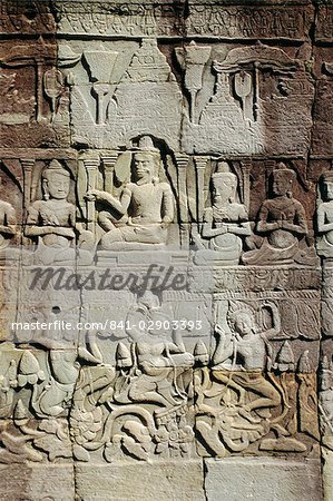 Stone bas-reliefs depicting scenes of rural life and historical events, in the Bayon Temple complex, Angkor, Siem Reap, Cambodia