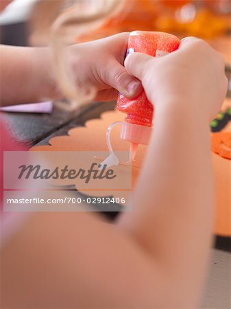 Little Girl Making Halloween Crafts