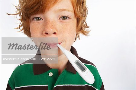 Portrait of Boy Having His Temperature Taken