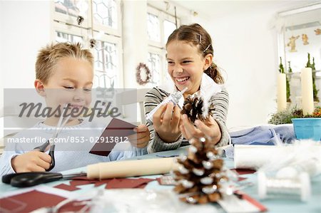 Two children doing crafts
