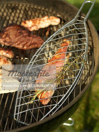 Fish and meat on grill