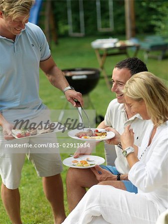 Adults having garden party