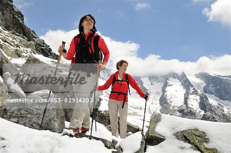 two women snowshoeing, Trentino Alto Adige italy