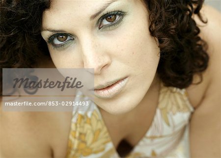 brown haired woman looking into camera, portrait