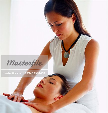 woman giving another woman a back massage