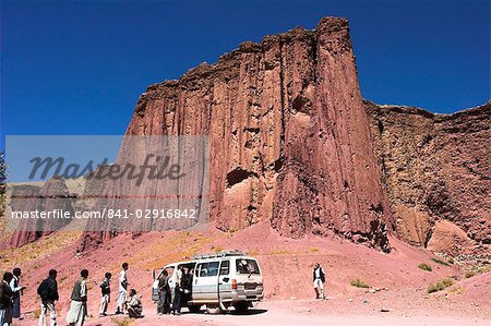 Tourist and locals at the Magenta cliffs near Shahr-e-Zohak (Red City), between Kabul and Bamiyan (the southern route), Bamiyan province, Afghanistan, Asia