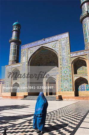 Lady wearing a blue burqua outside the Friday Mosque (Masjet-e Jam), Herat, Afghanistan, Asia