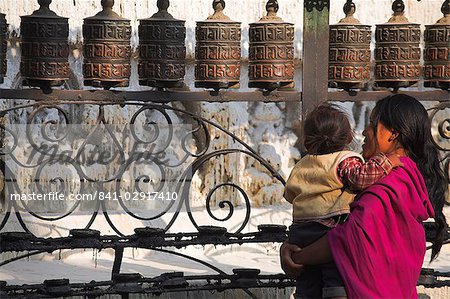 Pilgrim makes clockwise circumambulations of the stupa, Swayambhunath Stupa (Monkey Temple), Kathmandu, Nepal, Asia
