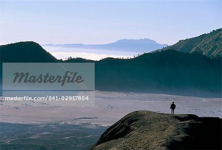 Tourist walking along rim of Gunung Bromo, Bromo-Tengger-Semeru National Park, Java, Indonesia, Southeast Asia, Asia