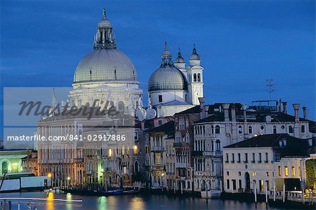 View along Grand Canal towards Santa Maria Della Salute church at night, Venice, UNESCO World Heritage Site, Veneto, Italy, Europe View along Grand Canal towards Santa Maria Della Salute church at night, Venice, UNESCO World Heritage Site, Veneto, Italy, Europe