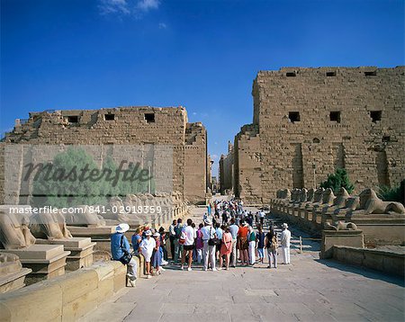 Crowd of tourists on the Processional Avenue, lined with ram-headed sphinxes, Temple of Karnak, Thebes, UNESCO World Heritage Site, Egypt, North Africa, Africa
