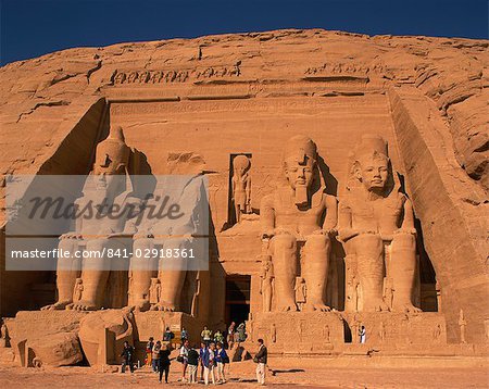 Tourists in front of the Temple of Re-Herakhte, built for Ramses II, also known as the Sun or Great Temple of Ramses II, Abu Simbel, UNESCO World Heritage Site, Nubia, Egypt, North Africa, Africa