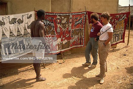 Tourists being shown batiks, near Korhogo, Ivory Coast, West Africa, Africa