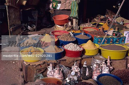 Plastic bowls containing spices for sale, in the souk at Taiz, Yemen, Middle East