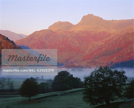 Morning mist, Great Langdale from Chapel Stile, Langdale Pikes in early morning light, Lake District National Park, Cumbria, England, UK