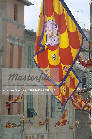 Flags and lamps of the Chiocciola (snail) contrada in the Via San Marco during the Palio, Siena, Tuscany, Italy, Europe