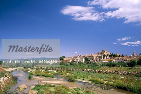 View to village across river, Peralada, near Figueras, Gerona, Catalonia (Cataluna) (Catalunya), Spain, Europe