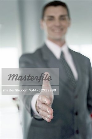 Businessman with hand out for handshake