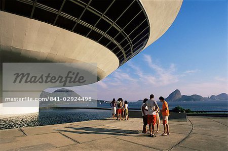 People looking at view across bay to Rio from Museo de Arte Contemporanea, by Oscar Niemeyer, Rio de Janeiro, Brazil, South America