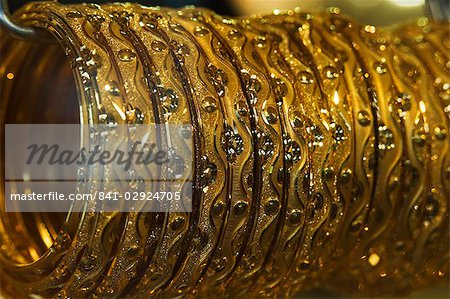 Close up of gold bangles on display, the Gold Souk, Deira, Dubai, United Arab Emirates, Middle East