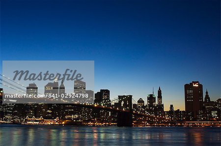 Manhattan skyline and Brooklyn Bridge at dusk, New York City, New York, United States of America, North America