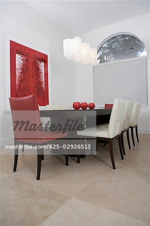 Decorative urns on a dining table in a dining room