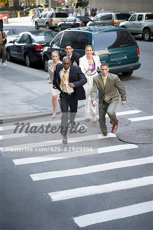 Business executives chasing a businessman