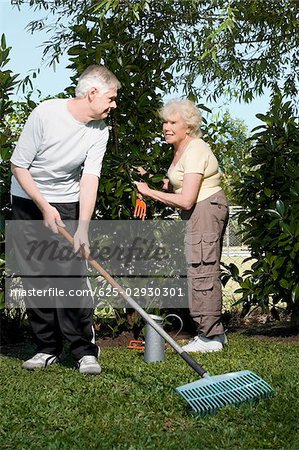 Senior couple gardening together