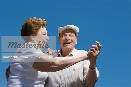 Low angle view of a senior couple dancing