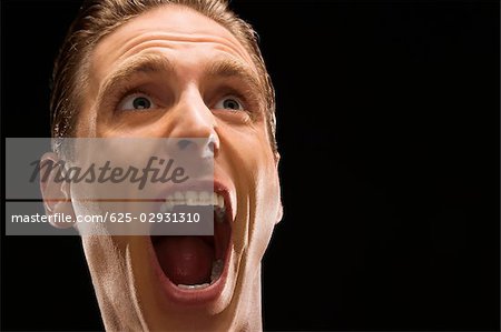 Close-up of a businessman shouting