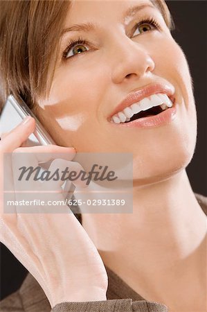 Close-up of a businesswoman talking on a mobile phone