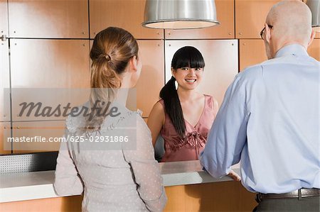 Rear view of business executives standing at a reception