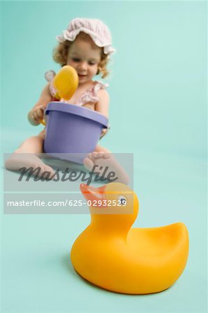 Girl playing with toys and smiling