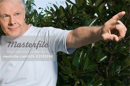 Close-up of a senior man pointing